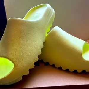 Yeezy slides size 9 . Brand new , never worn .